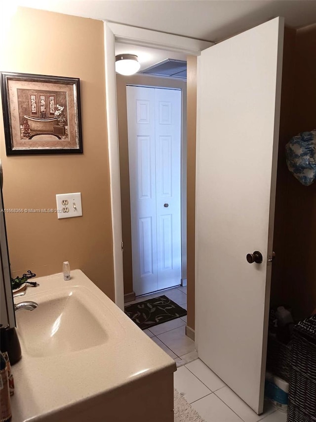 bathroom with sink and tile patterned floors