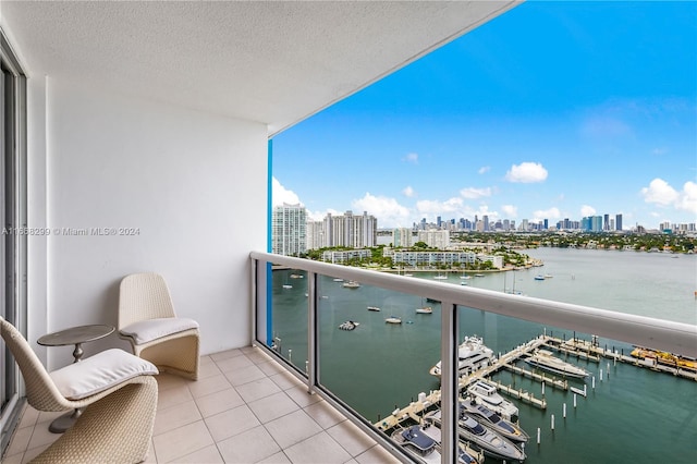 balcony featuring a water view