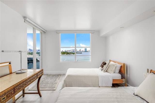 bedroom featuring hardwood / wood-style flooring and access to exterior