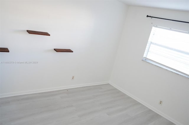 unfurnished room with light hardwood / wood-style flooring