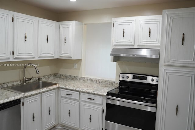 kitchen featuring exhaust hood, white cabinets, appliances with stainless steel finishes, and sink