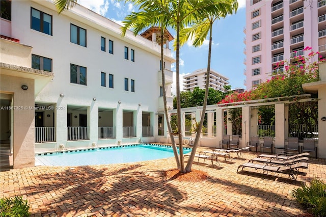 view of swimming pool with a patio area