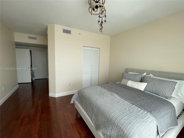 7275 SW 90th Way Unit 407, Miami, FL 33156 - bedroom featuring visible vents, baseboards, a closet, and wood finished floors