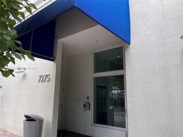 7275 SW 90th Way Unit 407, Miami, FL 33156 - property entrance with stucco siding