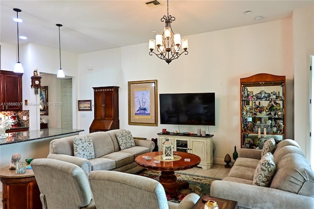 tiled living area featuring an inviting chandelier, baseboards, visible vents, and recessed lighting
