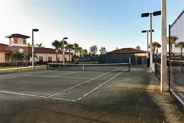 view of sport court featuring fence