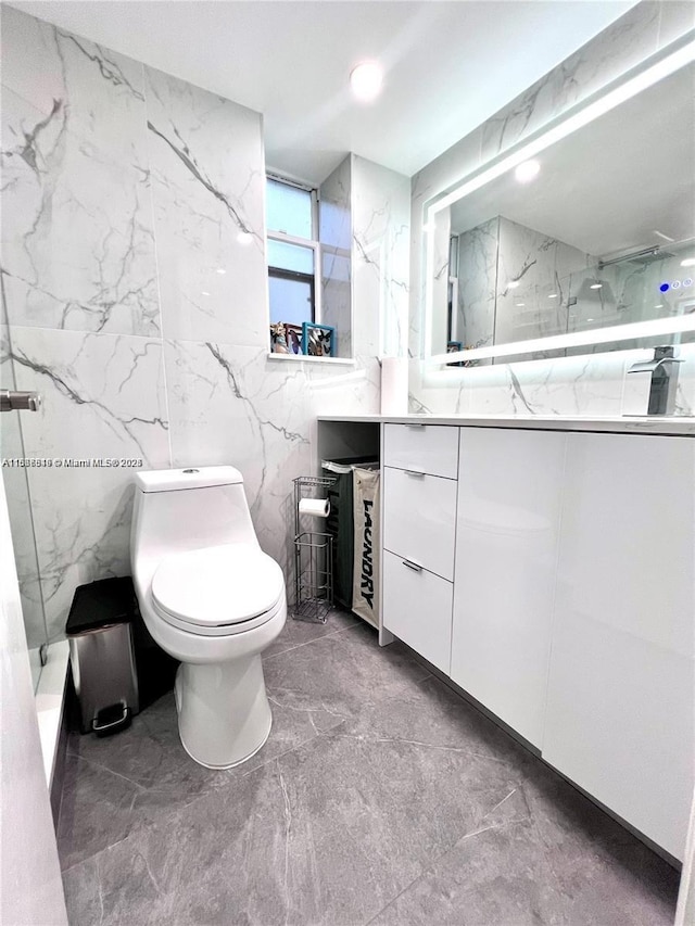 bathroom featuring vanity, toilet, and walk in shower