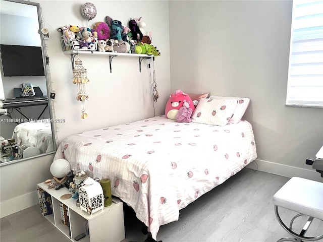 bedroom featuring wood-type flooring