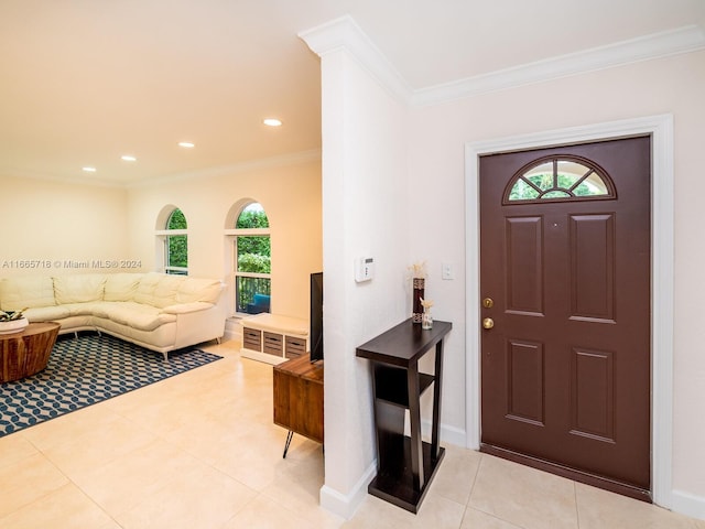 tiled foyer with ornamental molding