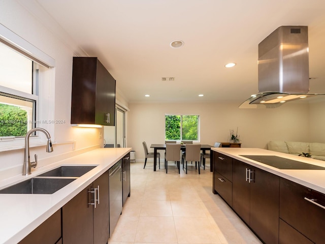 kitchen featuring black electric cooktop, dishwasher, wall chimney exhaust hood, sink, and dark brown cabinets