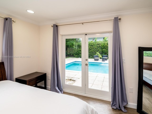 bedroom with french doors, hardwood / wood-style flooring, access to exterior, and crown molding