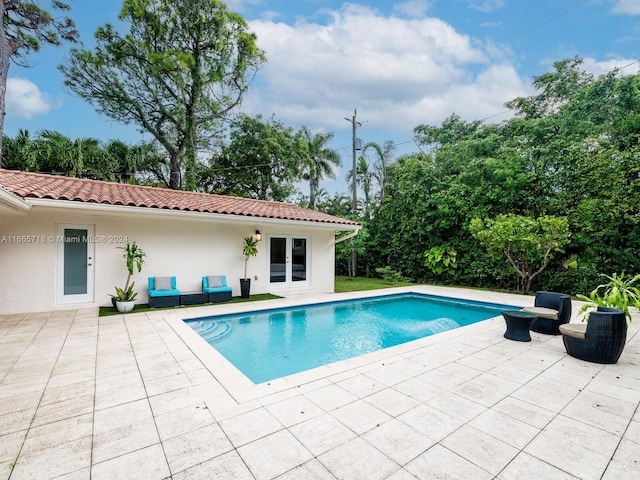 view of swimming pool featuring a patio