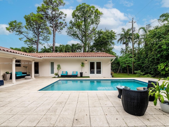 view of swimming pool with a patio area