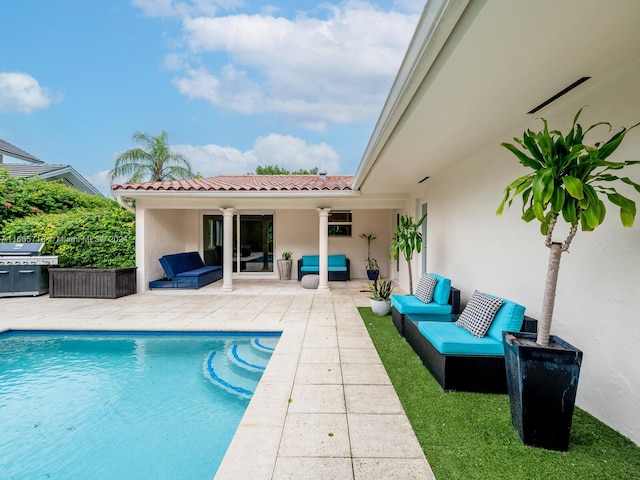 view of swimming pool featuring outdoor lounge area and a patio area