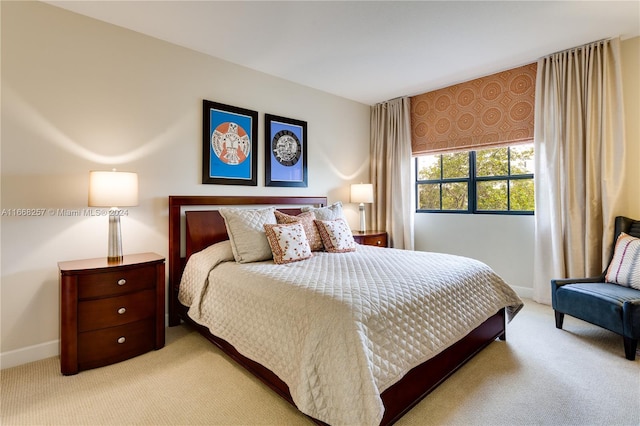 bedroom featuring light colored carpet