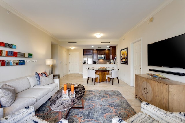 tiled living room featuring crown molding