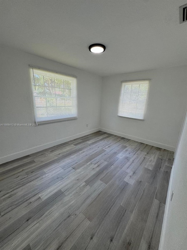 unfurnished room featuring light wood-type flooring