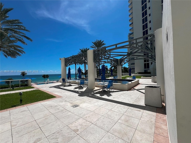 view of patio with a water view