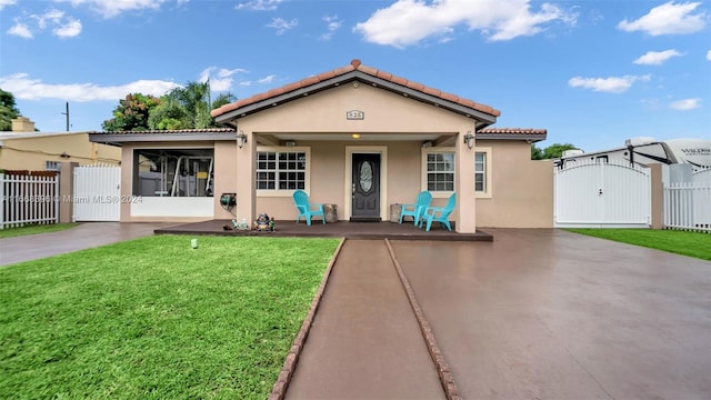 view of front of house with a front lawn and a porch