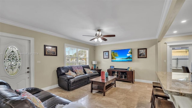 living room featuring ceiling fan and crown molding