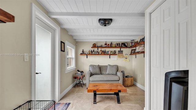 living area with wood ceiling and beamed ceiling