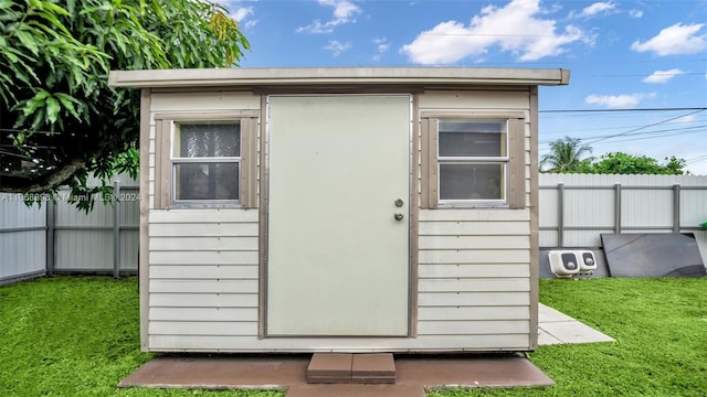 view of outdoor structure with a yard