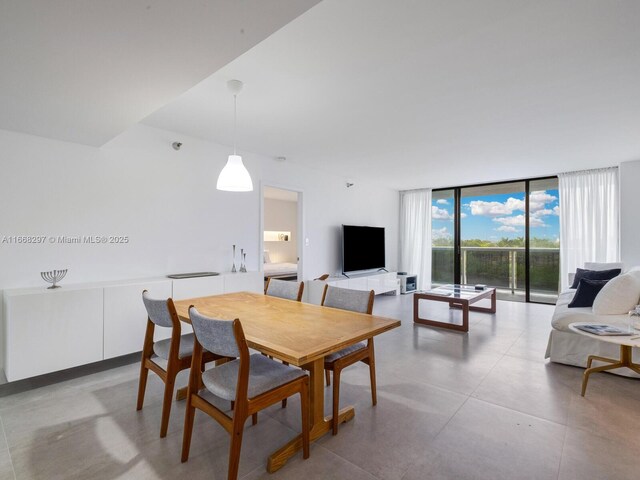 20505 E Country Club Dr Unit 531, Aventura, FL 33180 - dining space with concrete flooring and floor to ceiling windows