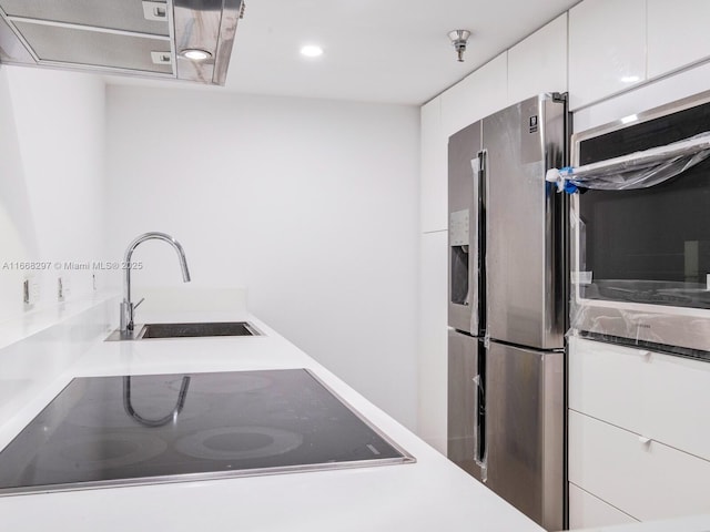 20505 E Country Club Dr Unit 531, Aventura, FL 33180 - kitchen with white cabinetry, stainless steel refrigerator with ice dispenser, black electric stovetop, and a sink