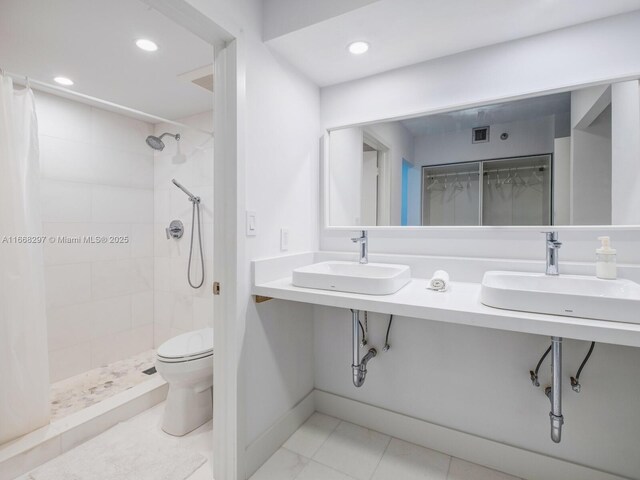 bathroom featuring vanity, toilet, and a shower with curtain