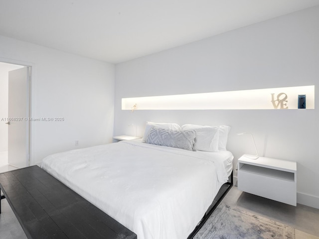 20505 E Country Club Dr Unit 531, Aventura, FL 33180 - bedroom with finished concrete floors