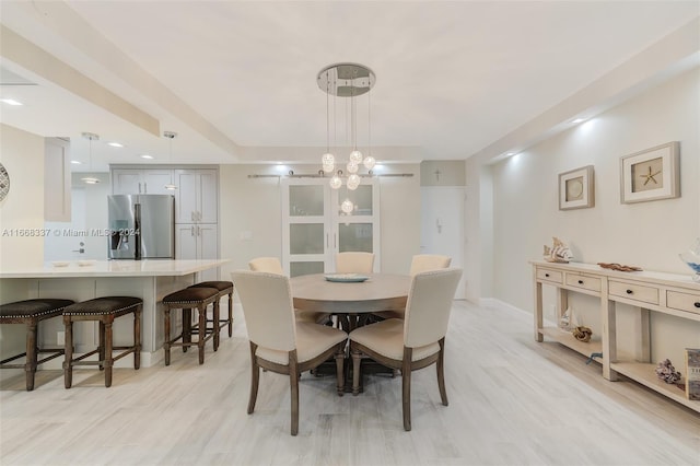 dining room with light wood-type flooring