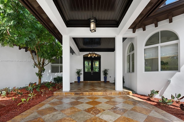 property entrance with french doors and a patio area