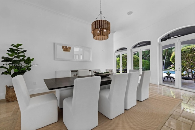 dining area featuring crown molding and french doors