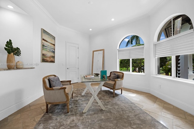 sitting room featuring crown molding