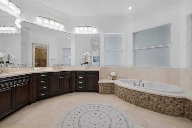 bathroom featuring vanity, a relaxing tiled tub, tile patterned floors, and crown molding