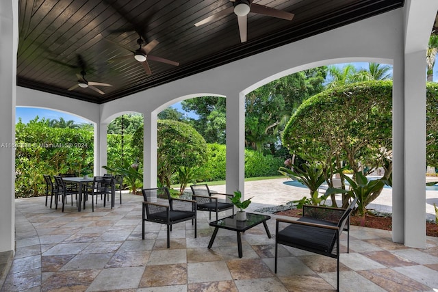 view of patio / terrace featuring ceiling fan