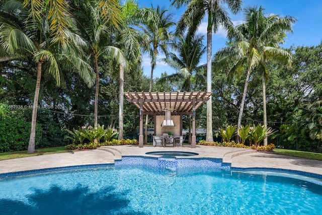 view of pool featuring an in ground hot tub, a pergola, and a patio