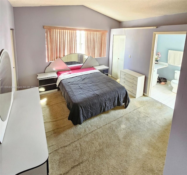 bedroom featuring lofted ceiling and carpet floors