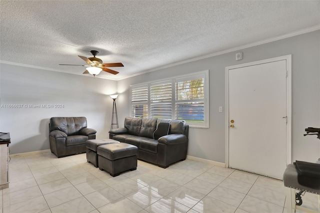 tiled living room featuring a textured ceiling, ceiling fan, and crown molding