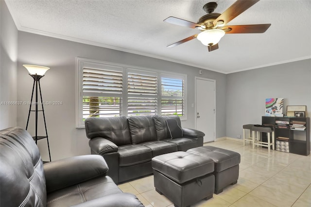 tiled living room featuring ornamental molding, ceiling fan, and a textured ceiling