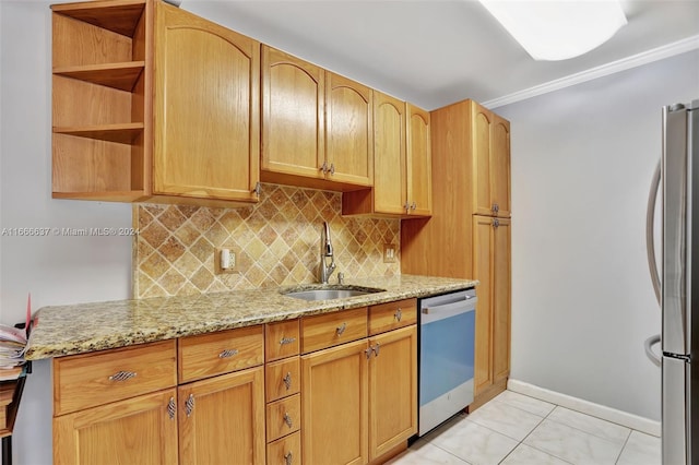 kitchen with sink, appliances with stainless steel finishes, light stone countertops, crown molding, and decorative backsplash