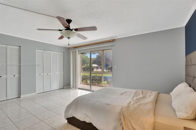 tiled bedroom featuring ceiling fan, access to exterior, and a textured ceiling