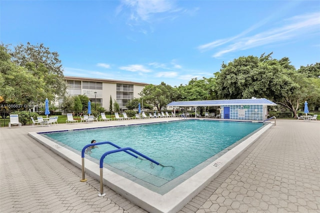 view of swimming pool with a patio area