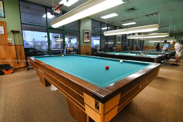 playroom featuring dark colored carpet, wood walls, and billiards