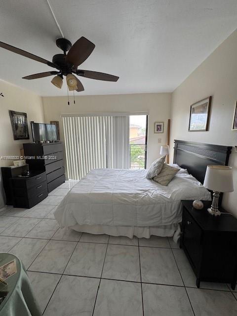 tiled bedroom with ceiling fan