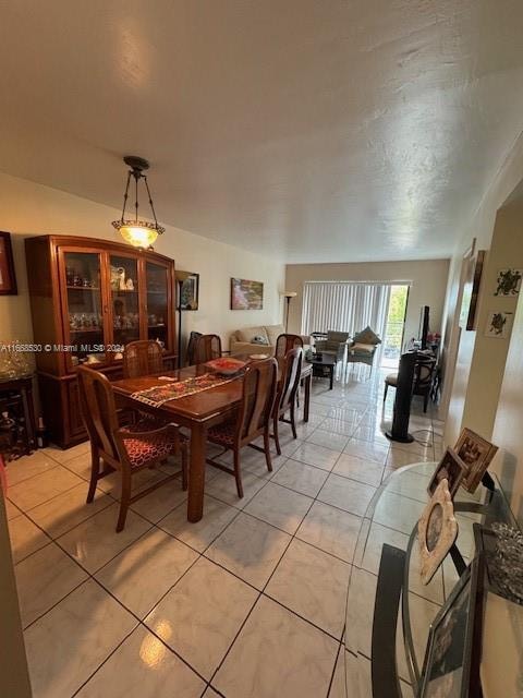 dining space with light tile patterned floors