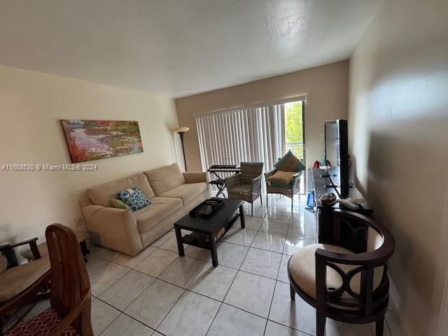 living room with light tile patterned floors