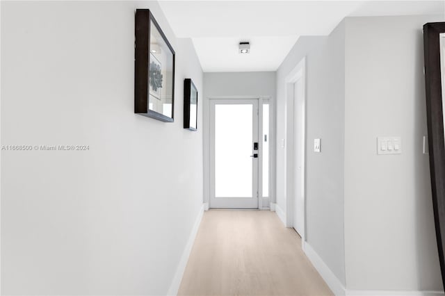 hallway with light wood-type flooring