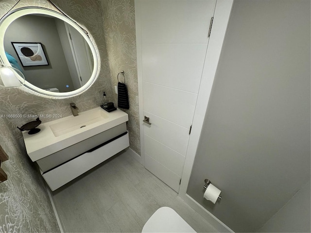 bathroom featuring vanity and toilet