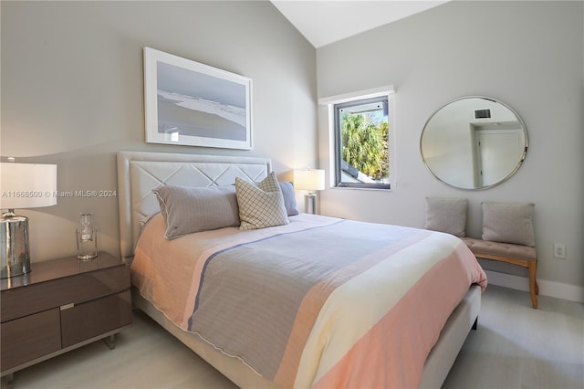 bedroom with vaulted ceiling